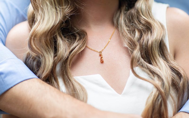 revelaire personalized customized name changing illusion jewelry necklace pendant around neck in 18 karat gold plated brass on woman with husband boyfriend gift idea